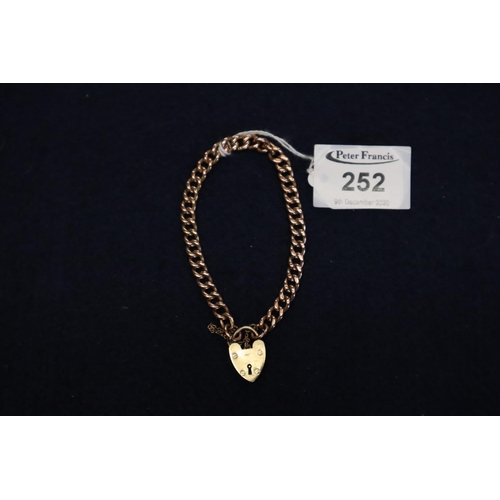 252 - 9ct gold curb link bracelet with 9ct heart shaped padlock clasp.  Approximate weight 21.4 grams.
(B.... 