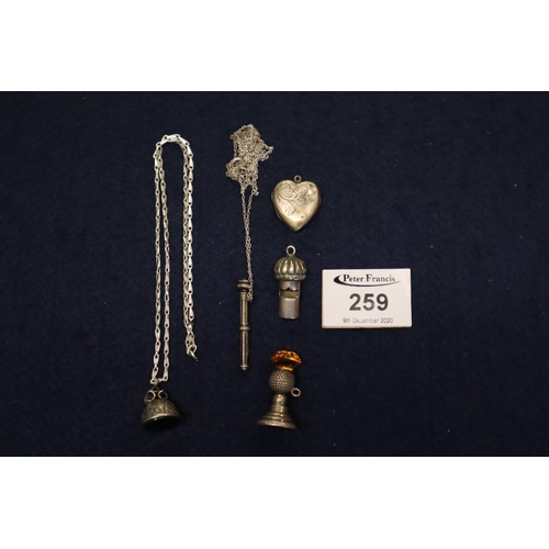 259 - Collection of silver and white metal items including a whistle, locket, a pencil, etc,
(B.P. 21% + V... 