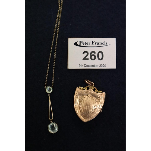 260 - An Art Nouveau aquamarine pendant and a gold plated locket.
(B.P. 21% + VAT)