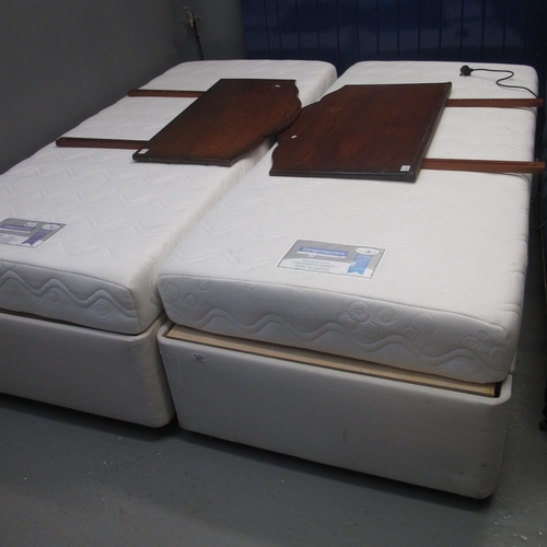 617 - Pair of electric modern single beds with sleepmaster matresses and two associate head boards. 
(B.P.... 