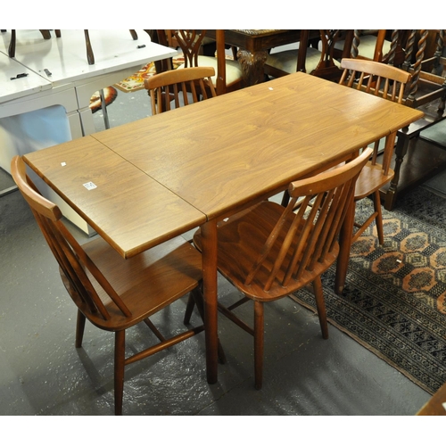 511 - Ercol design teak table with drop ends, together with a set of four Ercol style spindle kitchen chai... 