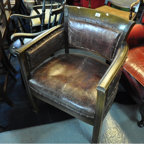 523 - Early 20th Century heavy oak leather upholstered office or library type elbow chair on fluted front ... 