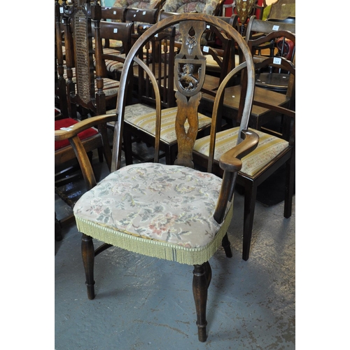 529 - Early 20th century stained beech slat back open armchair with carved lion crest.
(B.P. 21% + VAT)