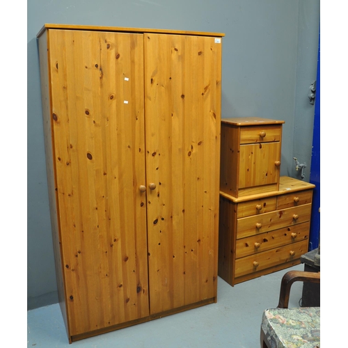 530 - Modern pine bedroom furnishing items to include; two door wardrobe, small straight front chest of dr... 