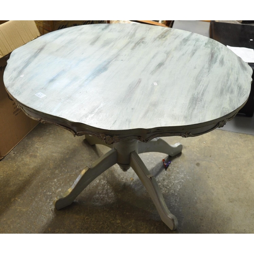 535 - 20th Century painted shabby chic centre table having piecrust top on a quatreform base.
(B.P. 21% + ... 