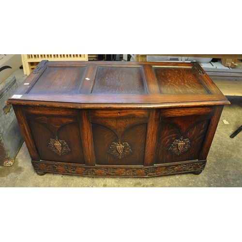 546 - Early 20th Century oak blanket box decorated with moulded berries and vines.
(B.P. 21% + VAT)