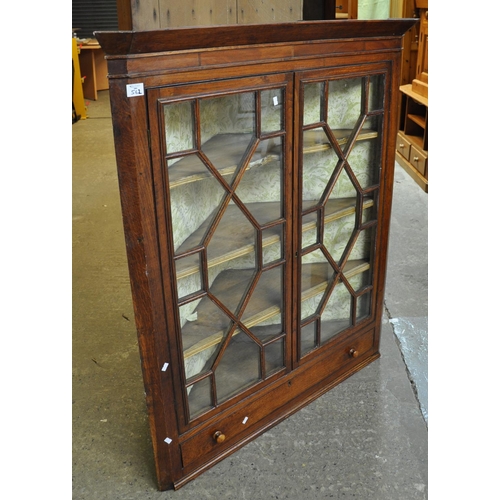 562 - 19th Century Welsh oak astragal glazed corner cabinet with under drawer.
(B.P. 21% + VAT)