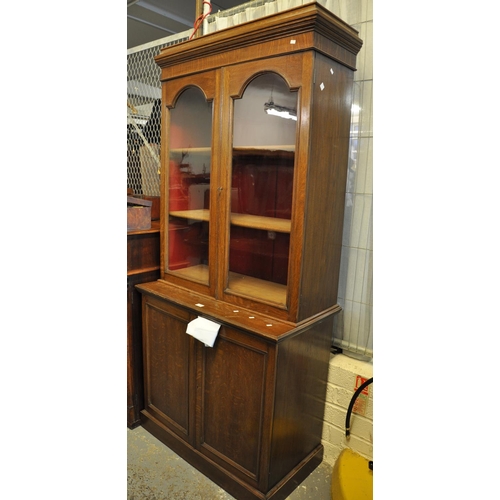 573 - Early 20th Century oak two stage cupboard or bookcase.
(B.P. 21% + VAT)