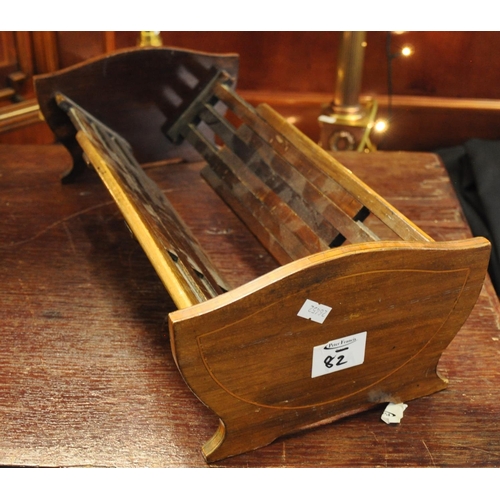 82 - Edwardian inlaid and cross banded mahogany extending book trough.
(B.P. 21% + VAT)