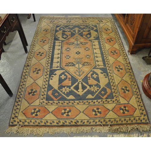 541 - Middle Eastern design cream and salmon ground carpet having stylised petal and floral decoration. 
(... 