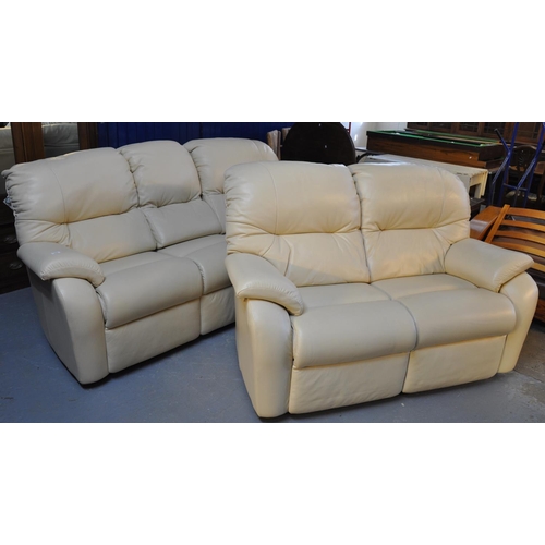 556 - Modern G Plan cream leather upholstered electric three seater sofa, together with a matching two sea... 