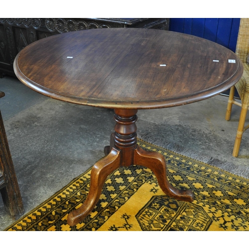 560 - Victorian mahogany tilt top centre table on triform base.
(B.P. 21% + VAT)