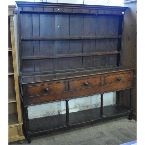 569 - Early 19th Century oak two stage rack back pot board dresser. 
(B.P. 21% + VAT)