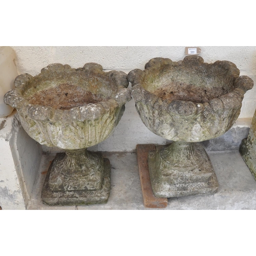 589 - A pair of modern composite garden urn shaped planters on stepped bases. (2)
(B.P. 21% + VAT)