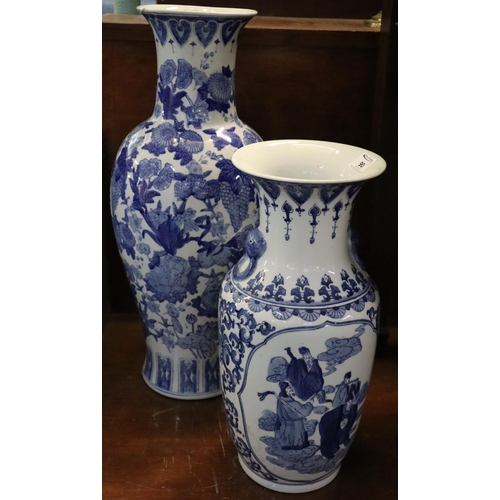 90 - Two oriental design modern blue and white baluster floor vases decorated with flowers and figures. (... 