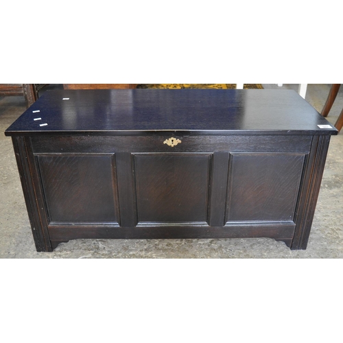 561 - 18th Century style stained oak three panelled coffer or blanket box, modern.
(B.P. 21% + VAT)