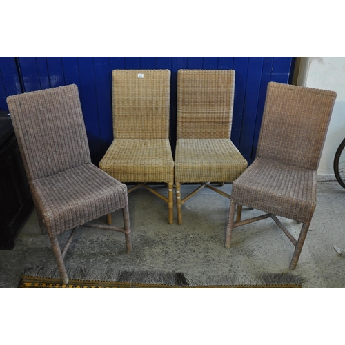 563 - Set of four modern wicker conservatory chairs on X frame supports. (4)
(B.P. 21% + VAT)