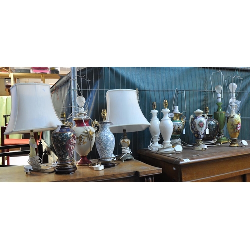 593 - Large collection of table lamps, some with shades, to include; porcelain and pottery floral designs,... 