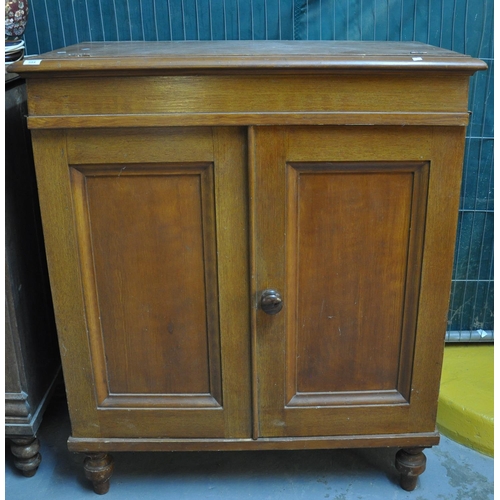 594 - Late Victorian scrumbled pine two door bed cupboard on baluster turned legs. 
(B.P. 21% + VAT)