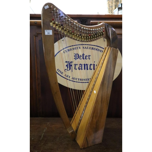 82 - Modern Welsh miniature harp in walnut, pine and fruit wood. 84cm high approx.
(B.P. 21% + VAT)