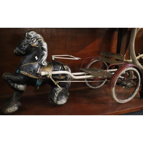 88 - A child's tinplate Momo type toy metal horse with two wheeled cart, pedal action, 105cm long approx.... 