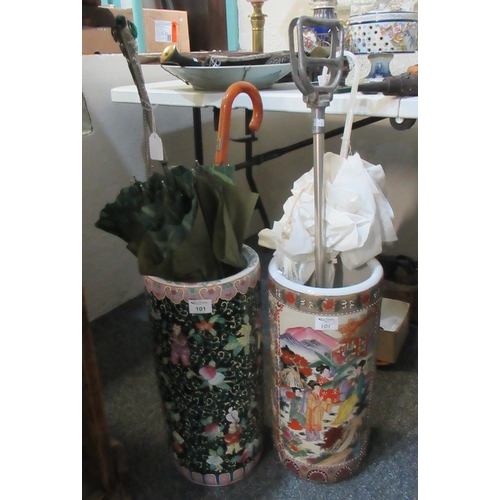 101 - Two oriental design ceramic stick stands containing various vintage umbrellas and a metal shooting s... 