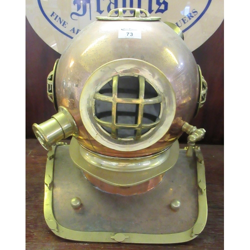 73 - Reproduction brass and copper divers helmet.
(B.P. 21% + VAT)