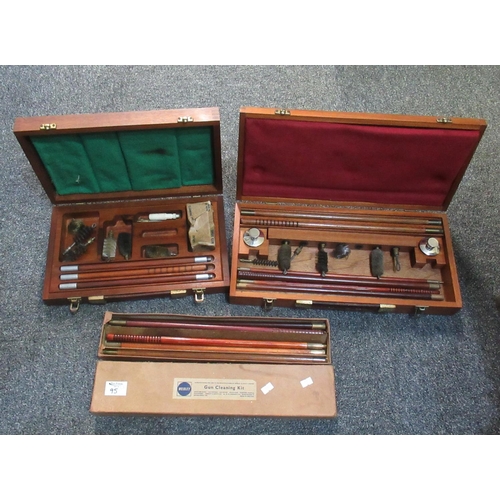 95 - Three shotgun cleaning kits, two in fitted wooden cases, one a Webley gu cleaning kit in card box,al... 