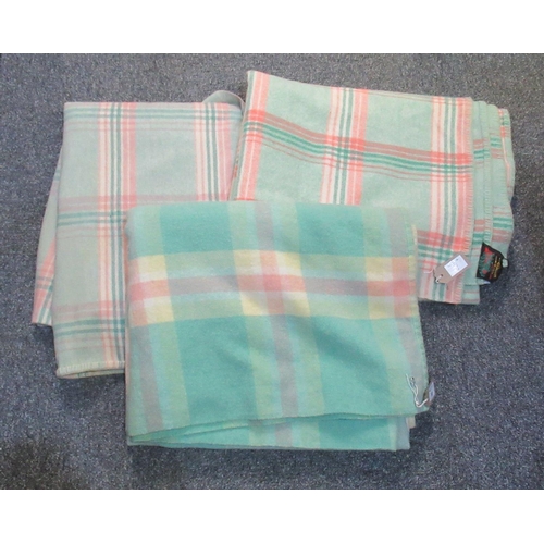 98 - Three woollen check design blankets or carthen, one with a Derw Made in Wales label. (3)
(B.P. 21% +... 