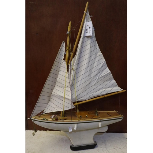 105 - Wooden and painted study of a pond yacht with sails. 
(B.P. 21% + VAT)