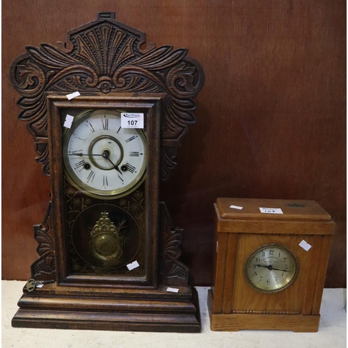 107 - Early 20th Century carved oak architectural probably American two train mantel clock. Together with ... 