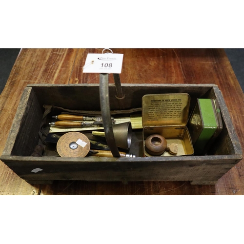 108 - Vintage wooden trug with assorted items to include; rulers, nutcracker, corkscrew, vintage tins etc.... 