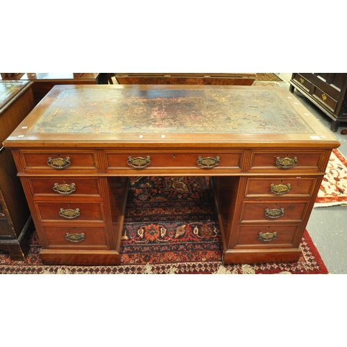 482 - Edwardian mahogany knee hole desk having leather inset top above bank of three drawers to each pedes... 
