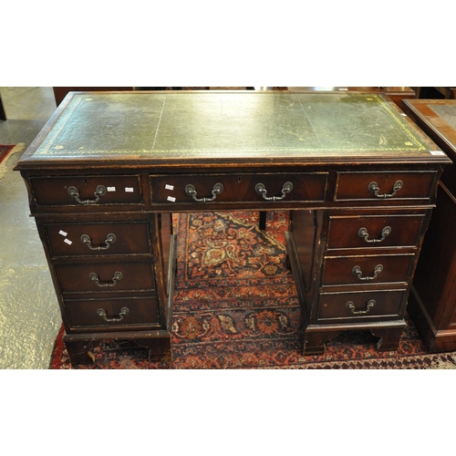 488 - Reproduction mahogany knee hole desk with leather inset top above a bank of three drawers to each pe... 