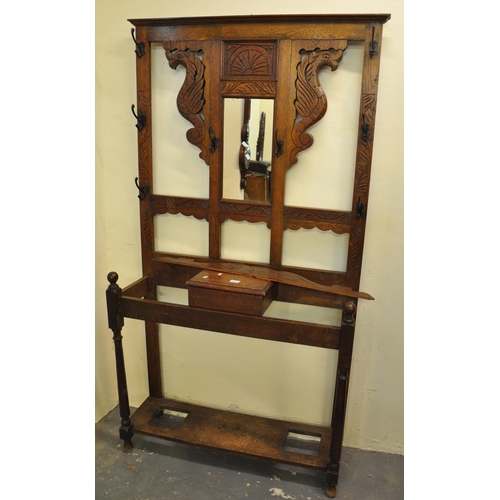 489 - Early 20th Century carved oak mirror back hall stand with dragon decoration.
(B.P. 21% + VAT)