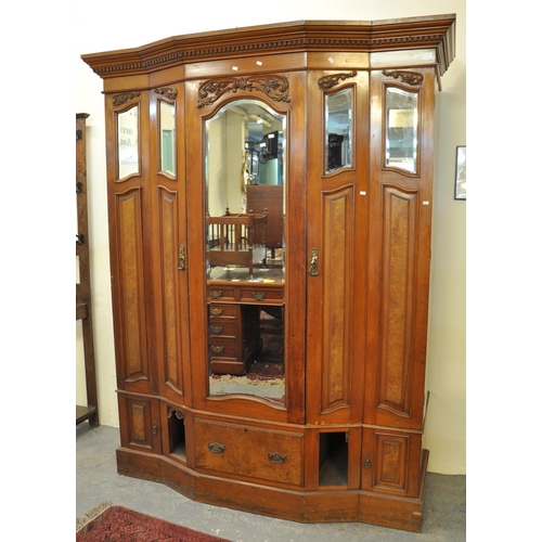491 - Edwardian walnut and mahogany break front mirrored wardrobe with dental cornice and fitted drawers. ... 