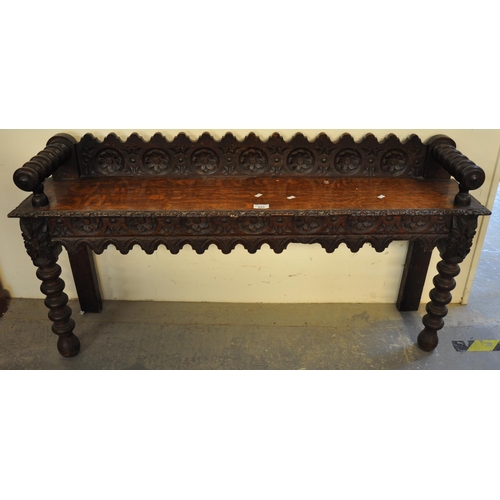 495 - Late Victorian heavily carved oak window or hall seat. 
(B.P. 21% + VAT)