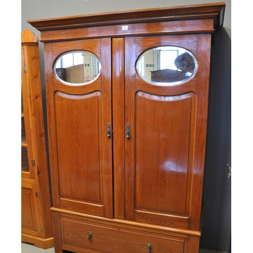 496 - Early 20th Century oak two door mirrored wardrobe. with under drawer. 
(B.P. 21% + VAT)