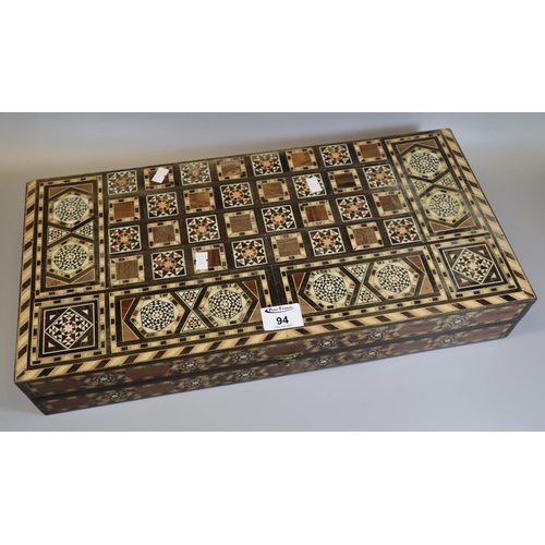 94 - Modern Middle Eastern design inlaid backgammon game. 
(B.P. 21% + VAT)