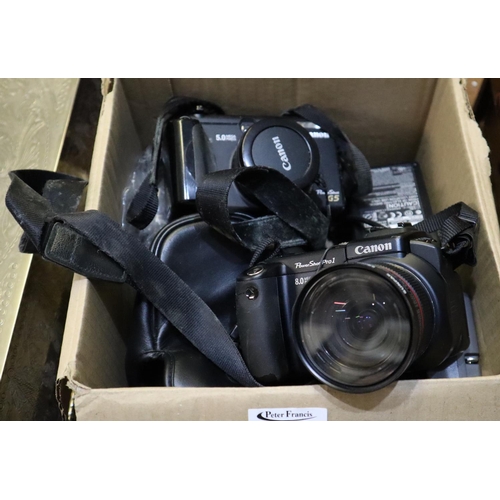 106 - Box of cameras and accessories to include Canon Powershot G5, Canon Powershot pro1, cables, etc.
(B.... 