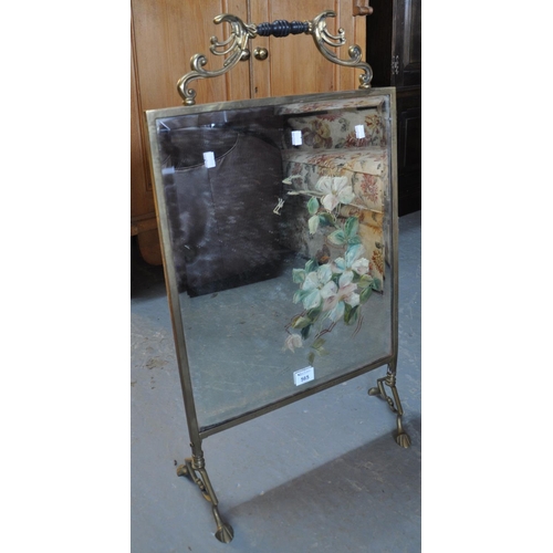 565 - Art Nouveau brass framed bevel plate mirrored firescreen with painted foliage and turned handle. 
(B... 