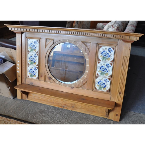 572 - Pine over mantel mirror, the moulded and dental cornice above a central circular bevel plate mirror ... 