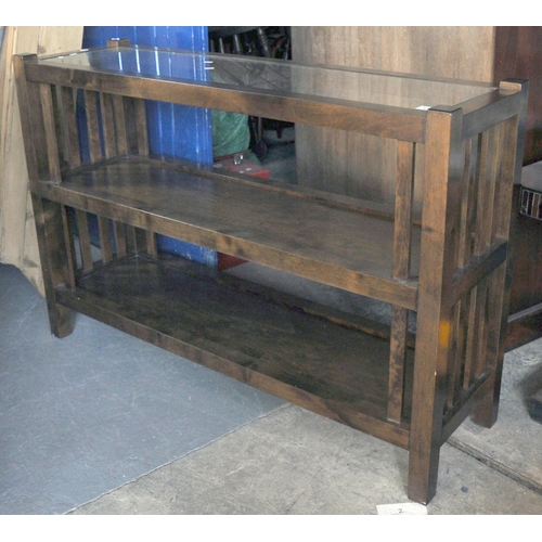 573 - Modern hardwood three tier console table with glass top and pierced sides. 
(B.P. 21% + VAT)