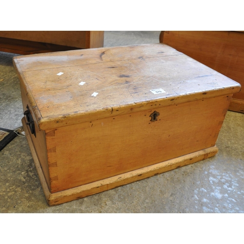 575 - Vintage pine trunk of rectangular form with cast metal carrying handles. 
(B.P. 21% + VAT)