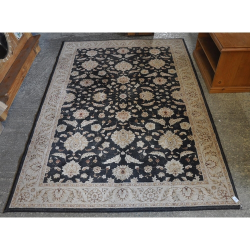 577 - An oriental design 'Elegance Mackenzie' floral and foliate carpet. 160 x 235cm approx. Modern.
(B.P.... 