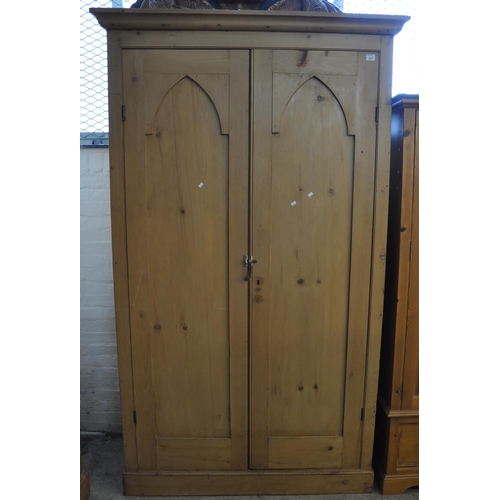 581 - Vintage pine two door blind panelled wardrobe with fitted shelves to the interior. 
(B.P. 21% + VAT)