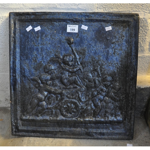 599 - 18th Century cast iron fire back with moulded cherub decoration.
(B.P. 21% + VAT)