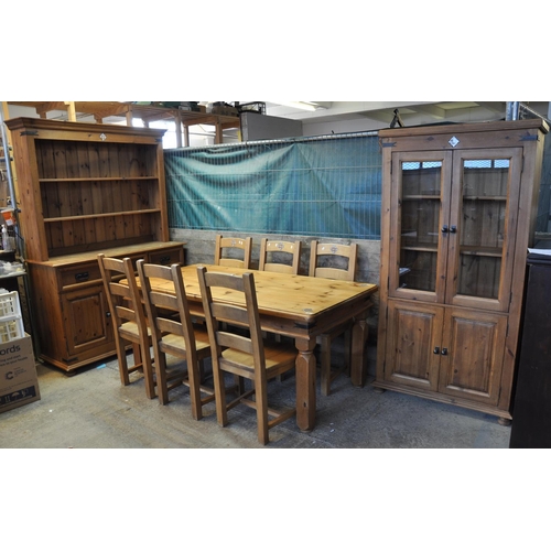 601 - Modern pine dining room suite comprising table and six chairs, rack back dresser and a two door glaz... 