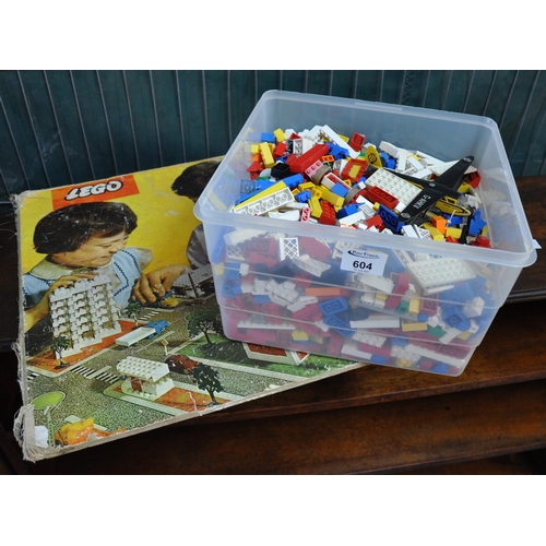 604 - Plastic box containing assorted vintage Lego, play worn Lego, together with a Lego system base board... 