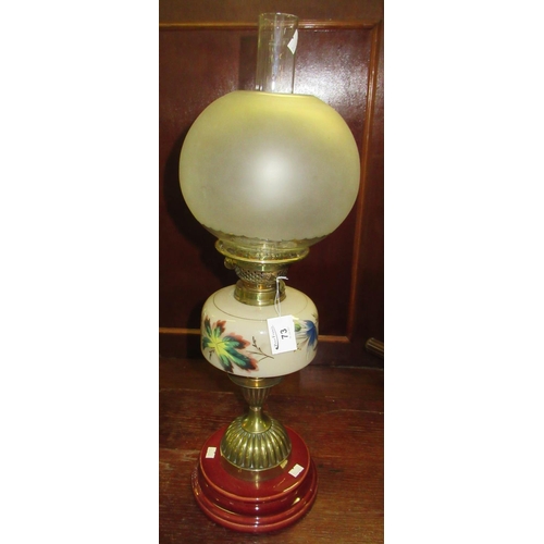 73 - Early 20th century double oil burner with globular frosted glass shade above a painted vaseline glas... 